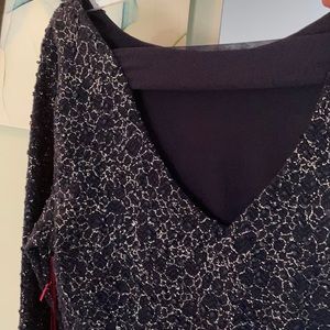 A beautiful garment in navy blue with delicate threading throughout.